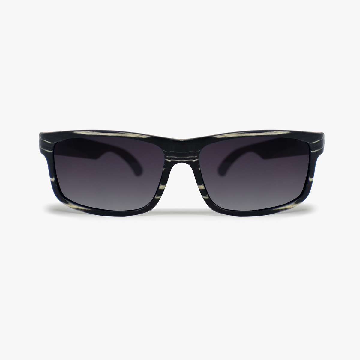 Lentes solares de madera chapada en ébano color negro con vetas en color blanco con lentes polarizados en color humo. Actitud Salvaje.  Despiertas pensando en nuevos caminos y nuevos retos, te gusta la naturaleza en su ámbito salvaje. Lentes Solares de Madera Viajero Cebra.